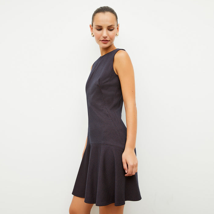 Front image of a woman wearing the jayde dress in navy multi