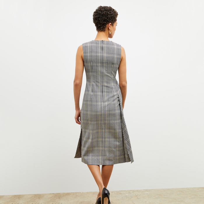 Back image of a woman wearing the jeannine dress in plaid sharkskin