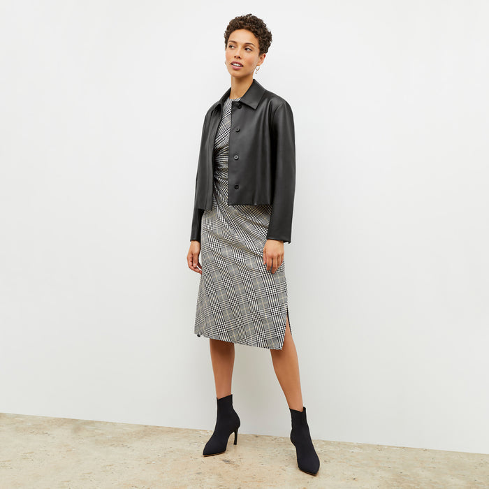 Front image of a woman wearing the jeannine dress in plaid sharkskin