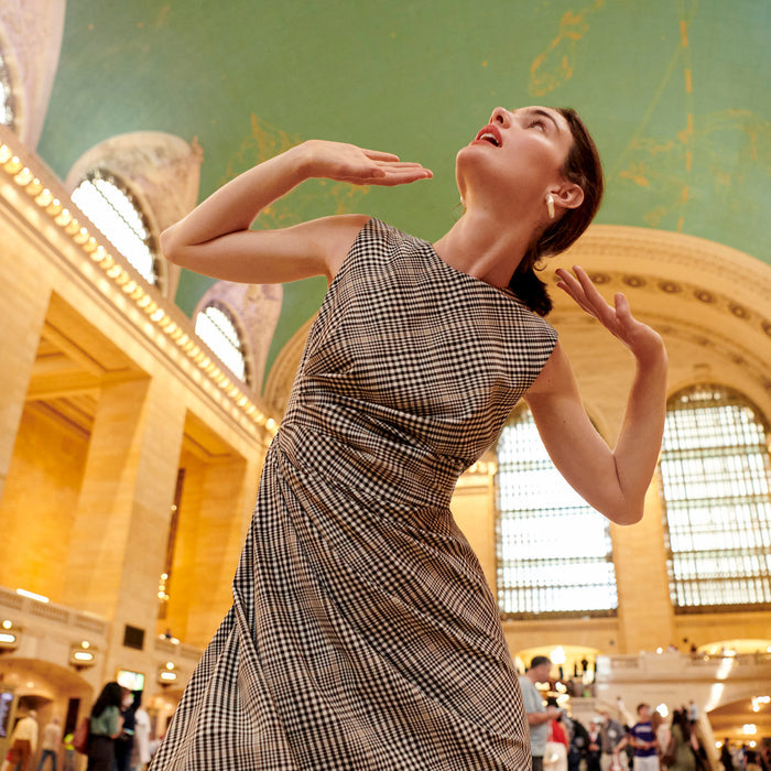 Front image of a woman wearing the jeannine dress in plaid sharkskin