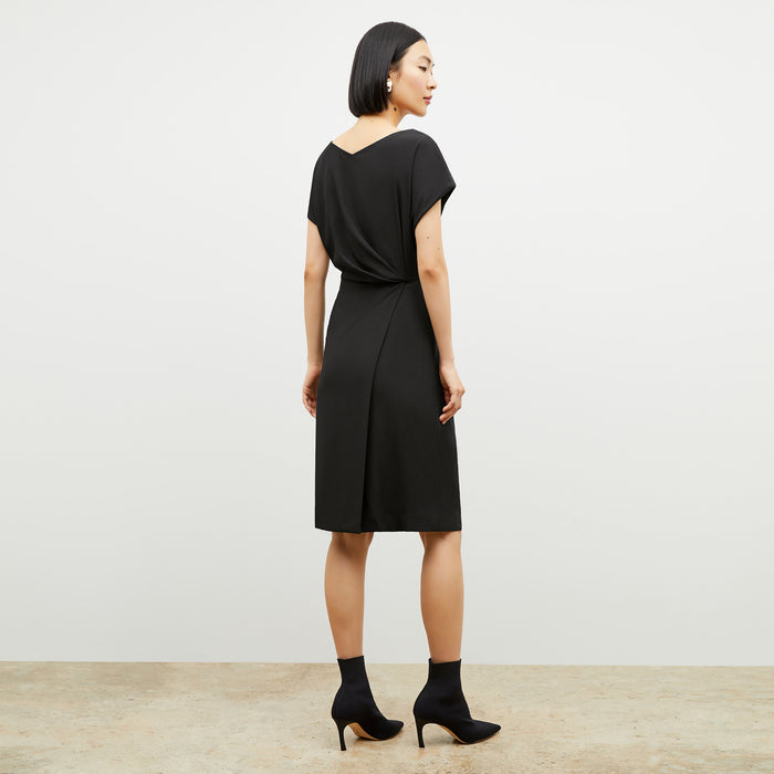 Back image of a woman wearing the jillian dress in black