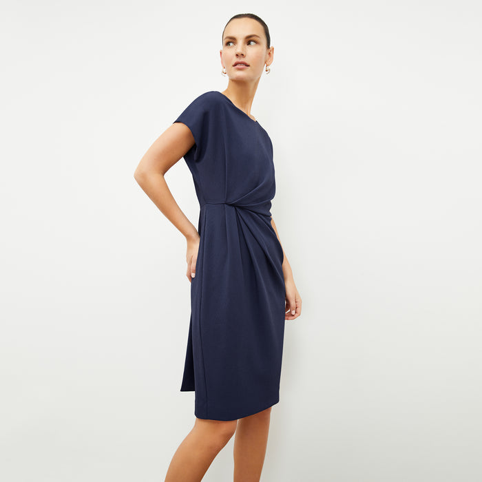 front image of a woman wearing the jillian dress in caspian blue | Lead