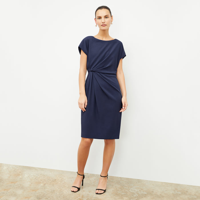 front image of a woman wearing the jillian dress in caspian blue
