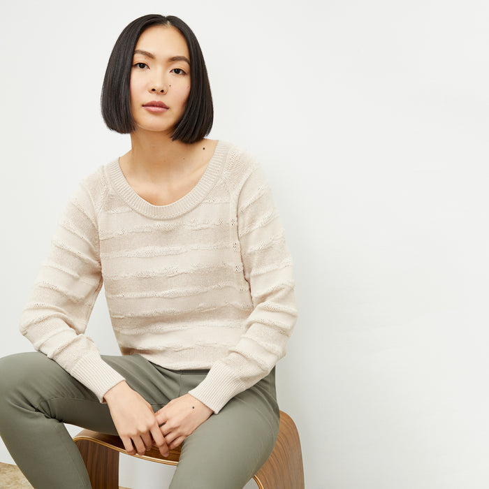 front image of a woman wearing the jo sweater in moonbeam | Lead