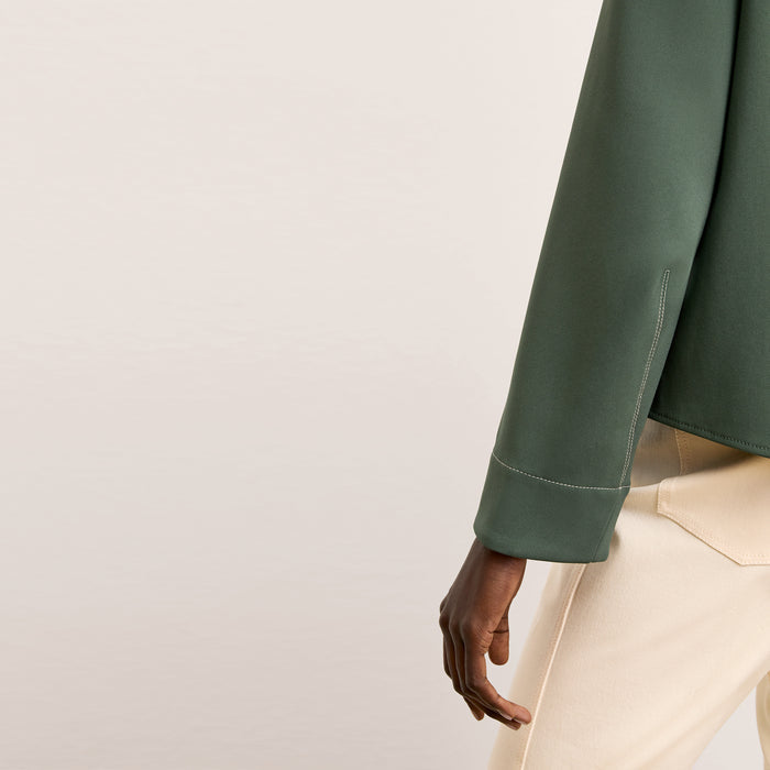 detail image of a woman wearing the jules top in dusty pine