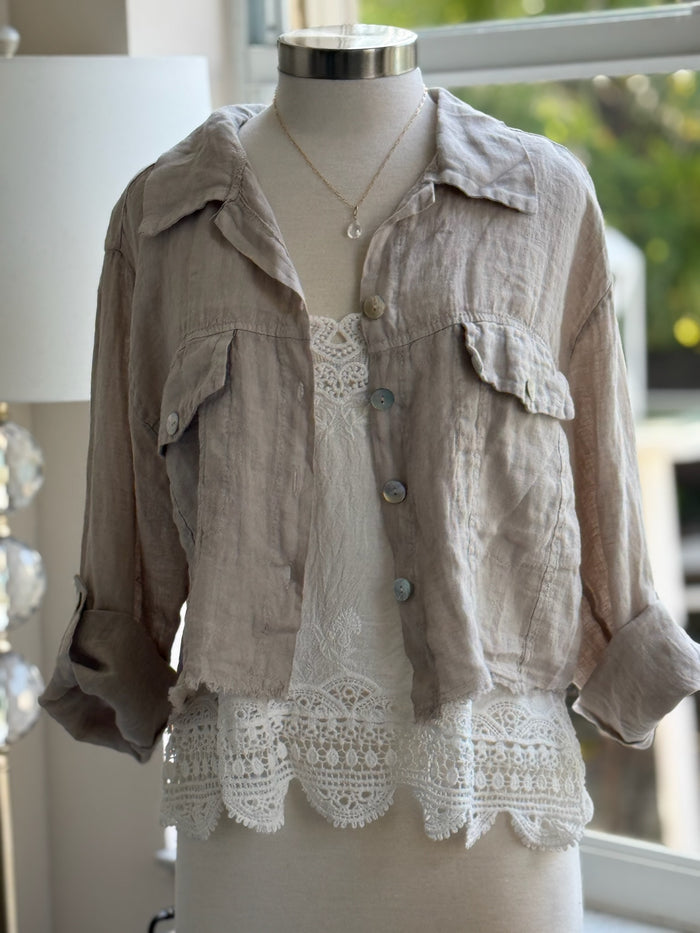 beige Italian linen jacket layered over a white lacy tank