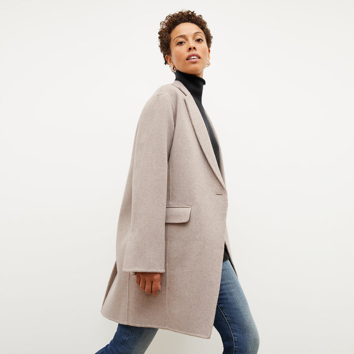 Front image of a woman wearing the kasha coat in stone melange