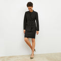 Front image of a woman wearing the kati jacket in black | Lead