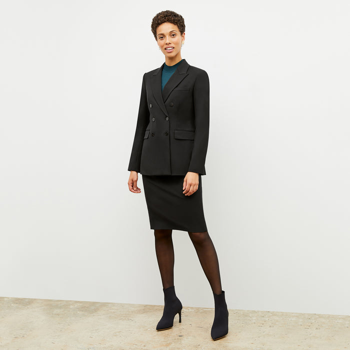 Front image of a woman wearing the kati jacket in black
