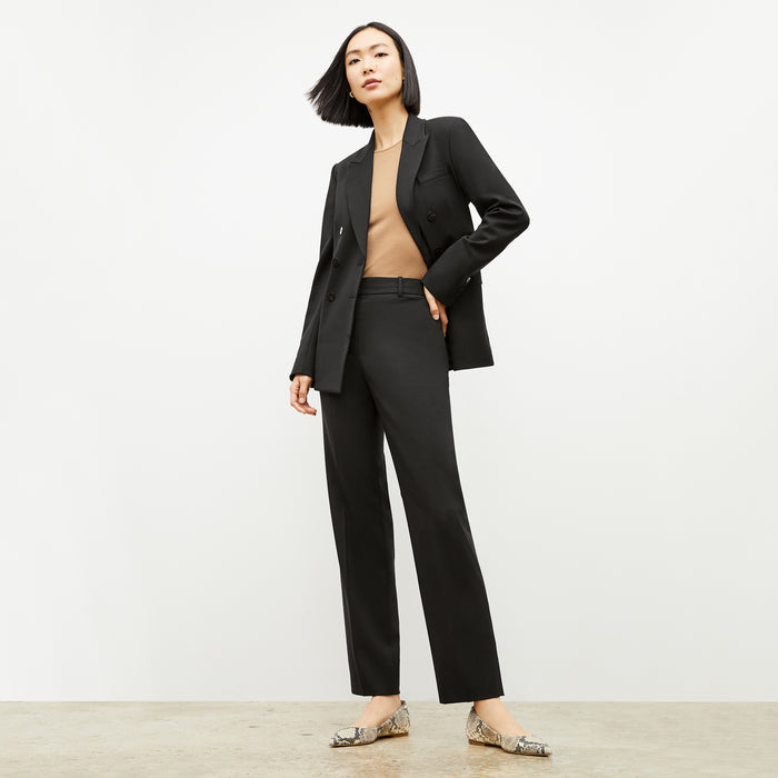 Front image of a woman wearing the kati jacket in black