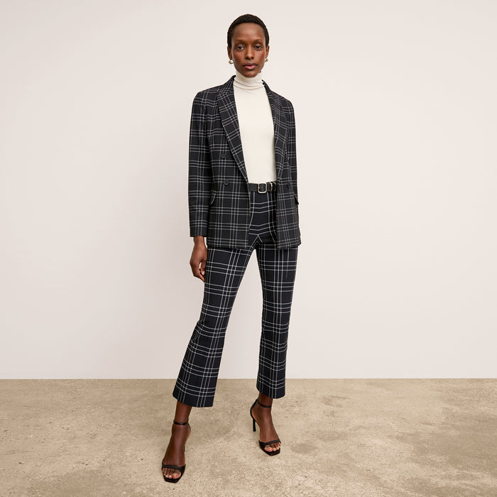 front image of a woman wearing the kick flare foster pant in plaid  | Lead