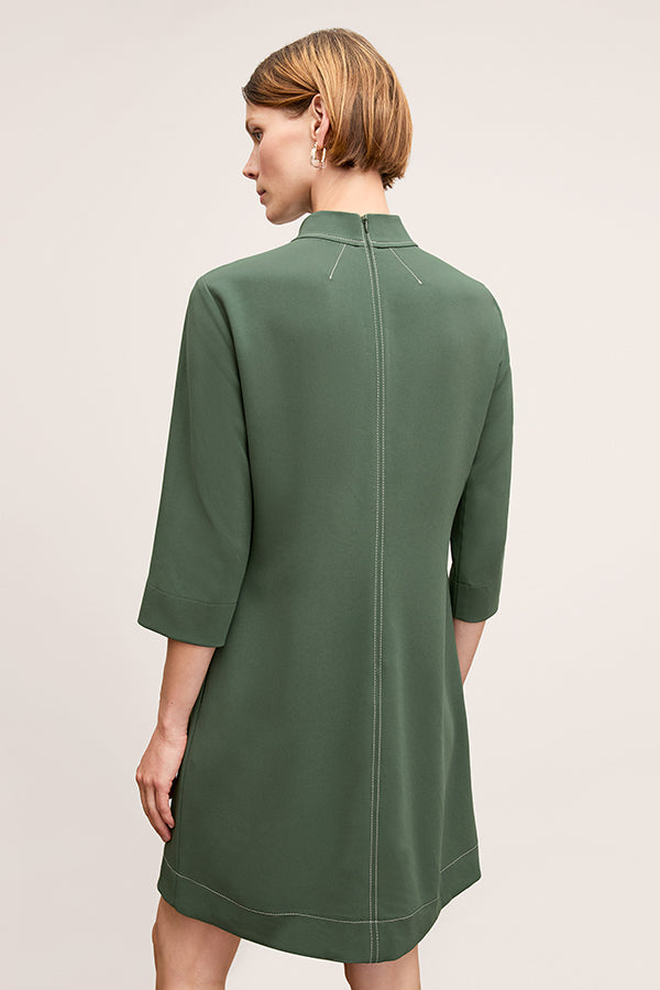 back image of a woman wearing the kinsley dress in dusty pine | Exclude | Grid Hover