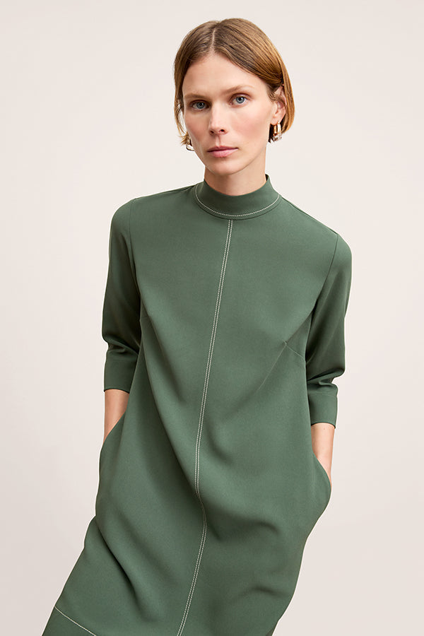 front image of a woman wearing the kinsley dress in dusty pine | Exclude