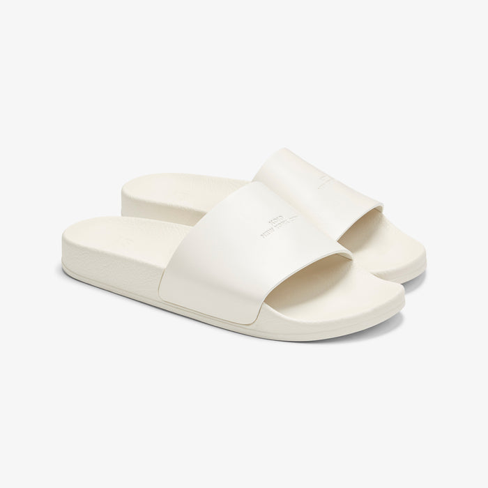 Packshot image of the KOIO Elba Slide - Leather in White | Lead