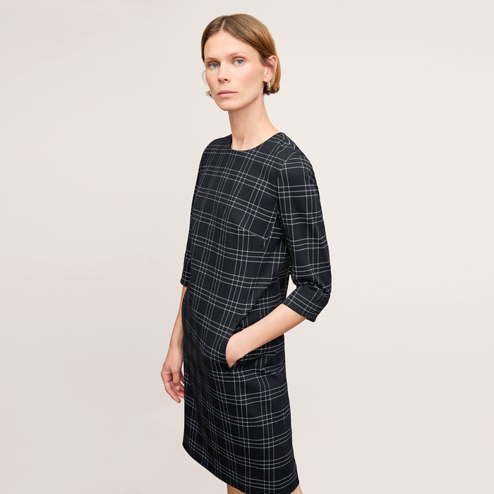 front image of a woman wearing the lancia dress in black/white | Lead