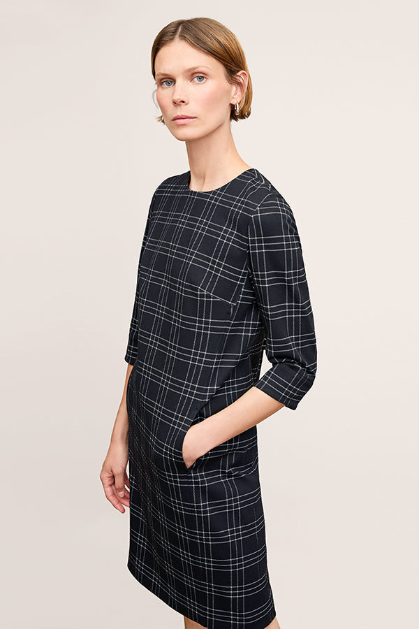 front image of a woman wearing the lancia dress in black/white | Exclude | Grid