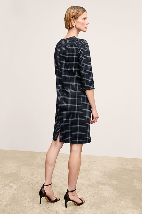 front image of a woman wearing the lancia dress in black/white | Exclude