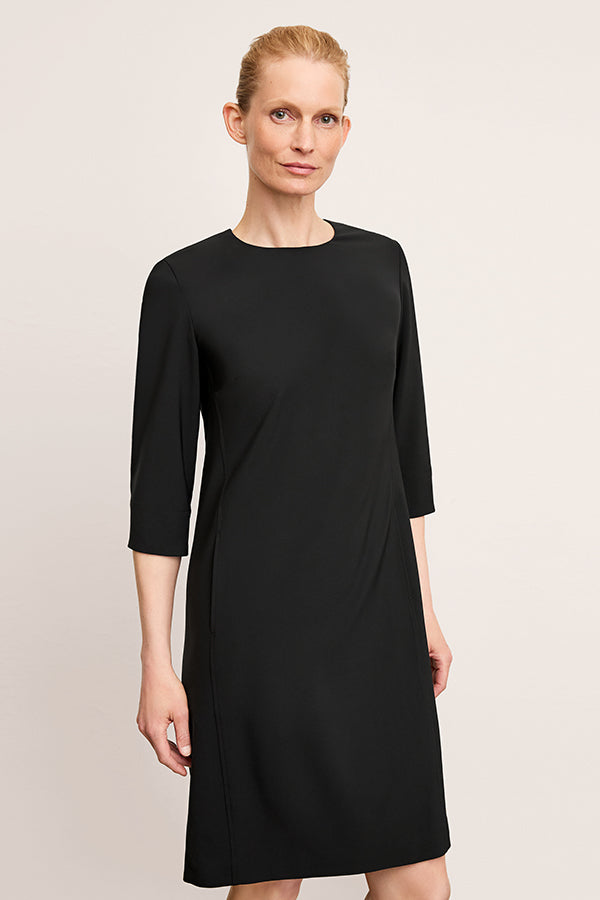 front image of a woman wearing the lancia dress in black | Exclude | Grid
