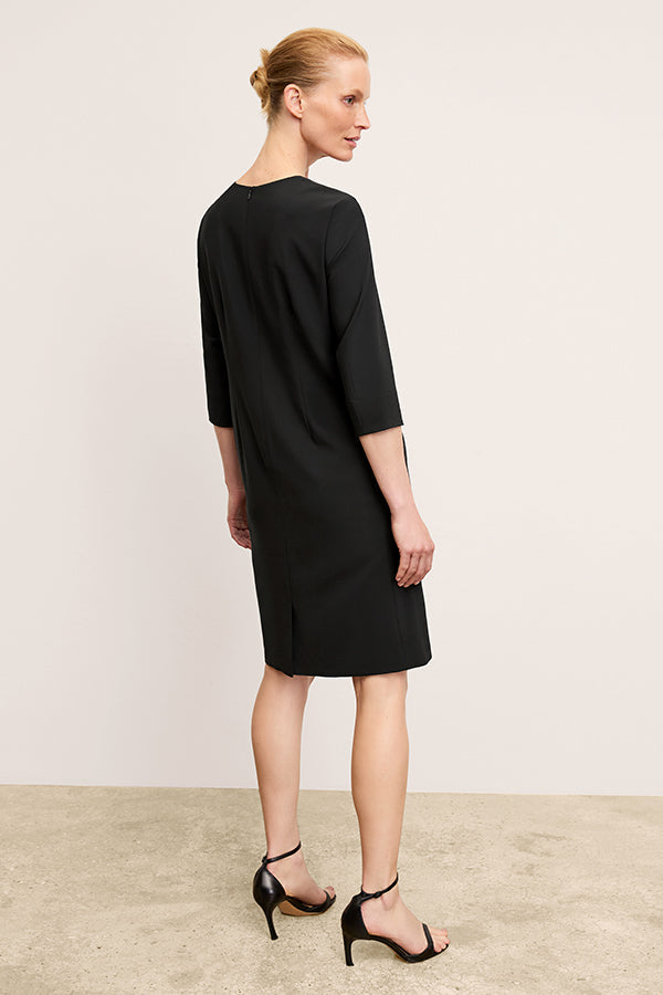back image of a woman wearing the lancia dress in black | Exclude | Grid Hover