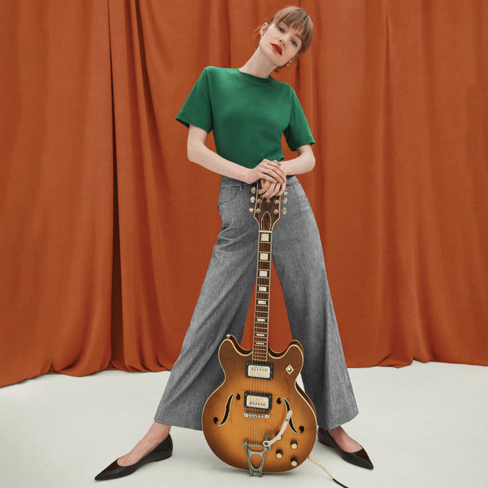 front image of a woman wearing the leslie tee in vine