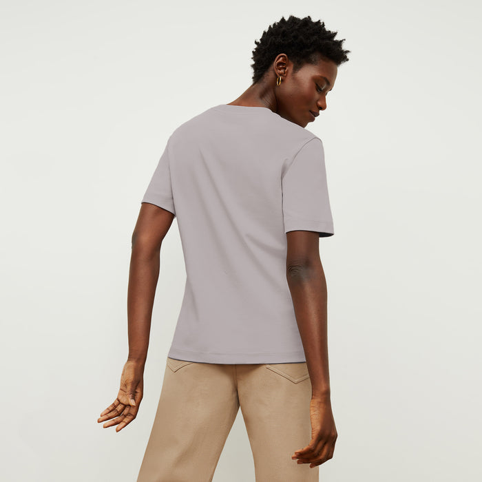back image of a woman wearing the leslie shirt in wisteria