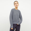 front image of a woman wearing the liam sweater in flint gray | Lead