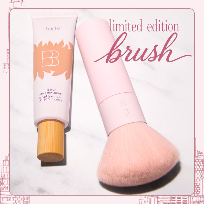 A Tarte BB Blur tinted moisturizer with a a large light pink makeup brush on a white background, with text reading 'limited edition brush'.