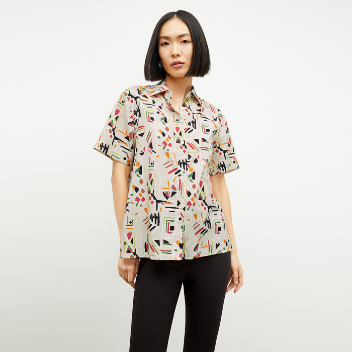 front image of a woman wearing the livingston top in rhythm print | Lead