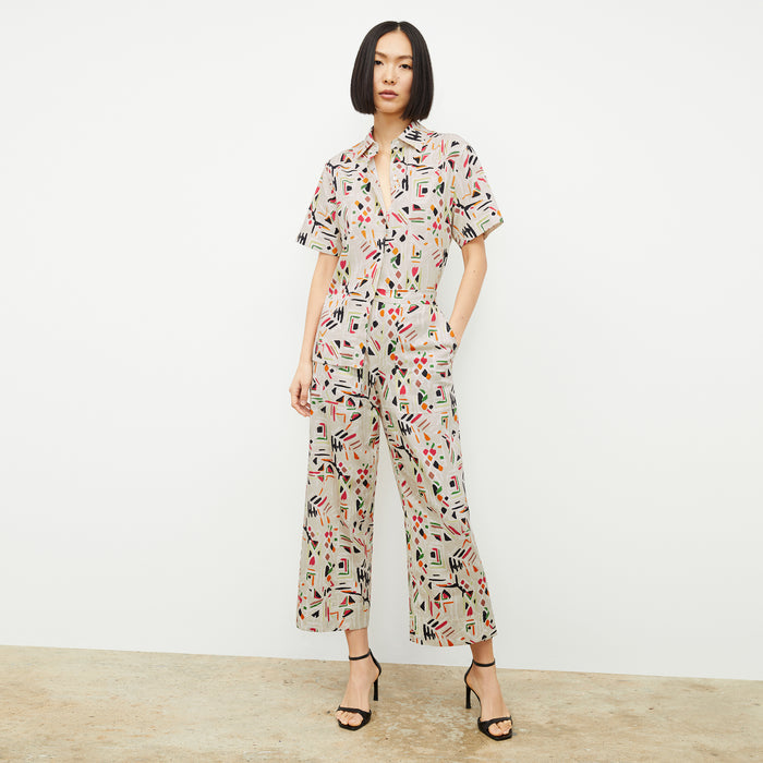 front image of a woman wearing the livingston top in rhythm print
