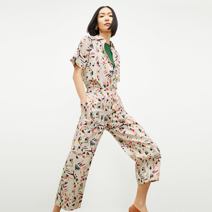 front image of a woman wearing the livingston top in rhythm print
