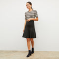 Front image of a woman wearing the luca skirt in black | Lead