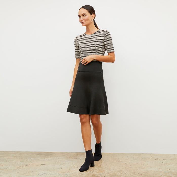 Front image of a woman wearing the luca skirt in black | Lead
