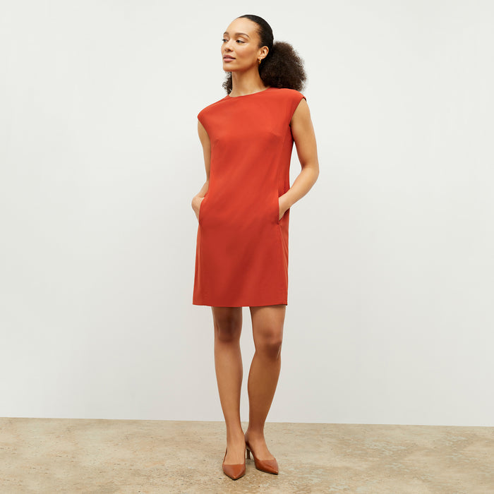 Front image of a woman wearing the Maaza Dress in Blood Orange