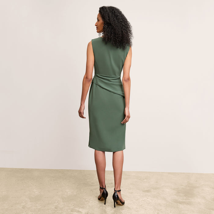 back image of a woman wearing the maisie dress in dusty pine