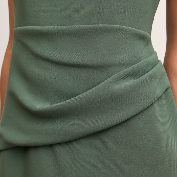 front image of a woman wearing the maisie dress in dusty pine