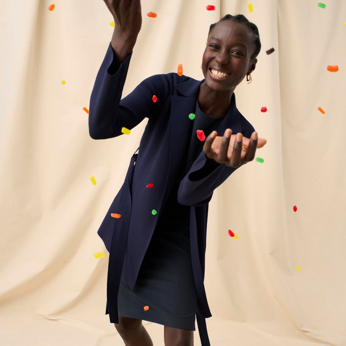 Front image of a woman in the maisie dress in midnight