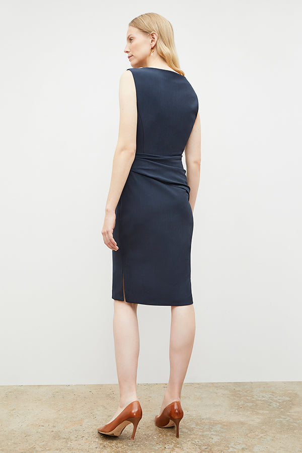 Back image of a woman in the maisie dress in midnight | Exclude | Grid Hover