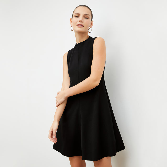 Front image of a woman in the malala dress in black | Lead
