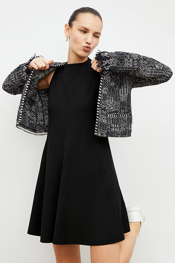 Front image of a woman in the malala dress in black | Exclude
