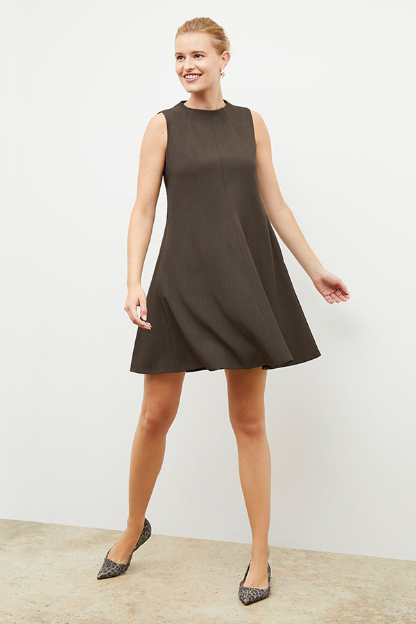 Front image of a woman wearing the malala dress in kale | Exclude | Grid