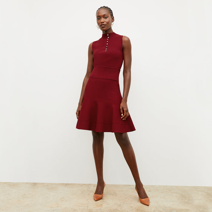Front image of a woman wearing the malki top in maroon