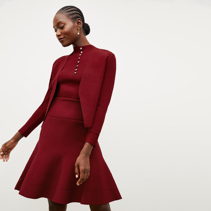 Front image of a woman wearing the malki top in maroon