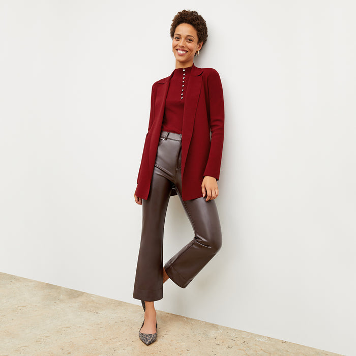 Front image of a woman wearing the malki top in maroon