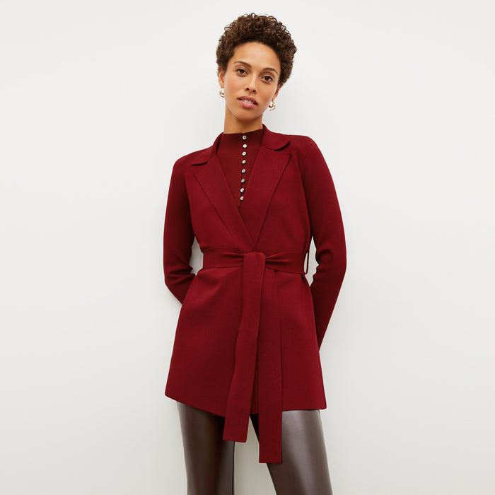 Front image of a woman wearing the malki top in maroon