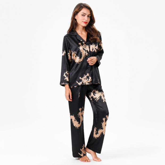 Women's classic black matching couple pajamas with gold dragon and phoenix print, glossy long-sleeve top and full-length pants.