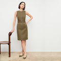 front image of a woman wearing the maude dress in oregano | Lead