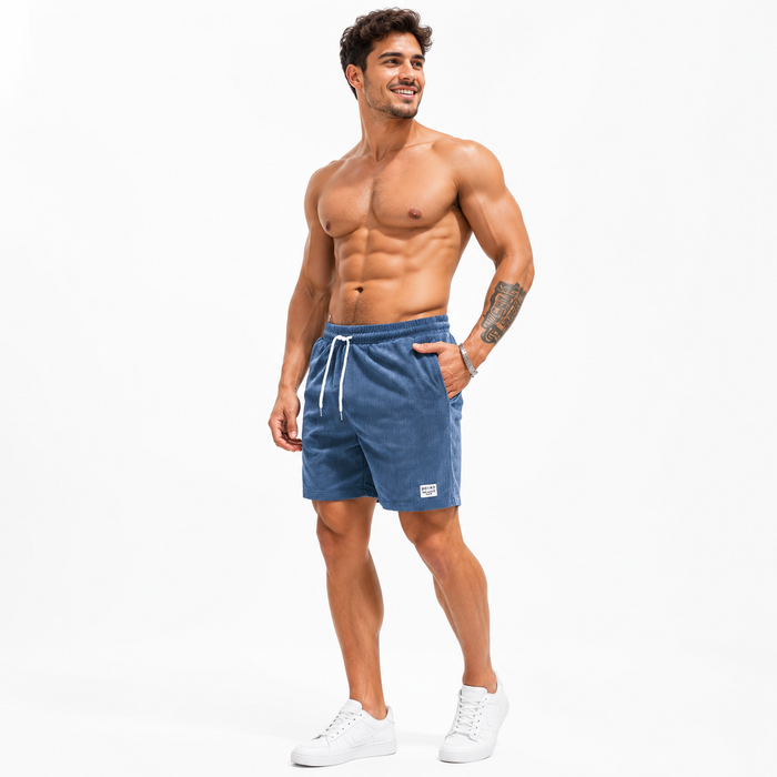 Men's blue corduroy shorts with drawstring waist shown on a male model against a clean white studio background.