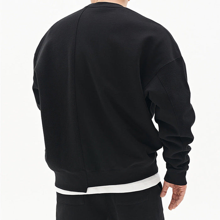 Original men's black round neck sweater back view showing loose fit, long sleeves and layered white hem.
