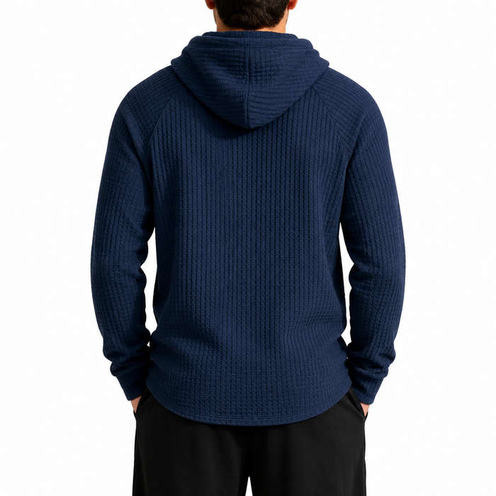 Men's navy waffle knit hoodie, rear view showing hood, raglan sleeves and curved hem.