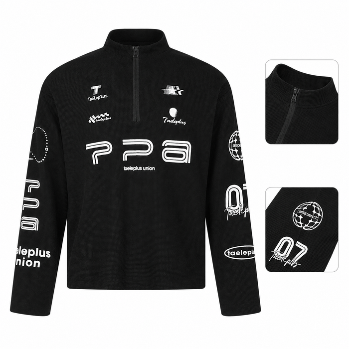 Black men's waffle knit long sleeve shirt product view with zip neck, graphic print and sleeve details.